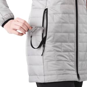A lightweight, packable women's puffer jacket in grey, featuring a zippered pocket and a branding logo.