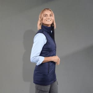 A lightweight, packable insulated puffer vest in navy blue, featuring a high collar and zippered pockets.