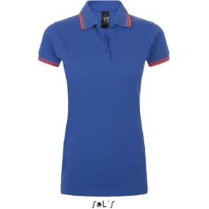 A women's polo shirt in blue with red collar stripes, made from 100% ring spun cotton. It features a logo.