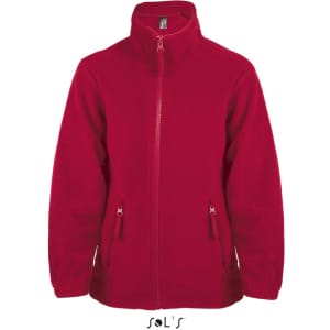 A red zip fleece jacket for kids with zippered pockets and a high collar. It features a logo on the upper front.