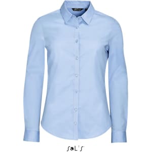 A women's long sleeve stretch shirt in light blue with a button-up front and collar. It features a branding logo.