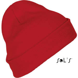 A red beanie made of 100% acrylic, featuring a simple design and a logo on the side.
