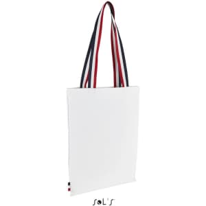 A white shopping bag with red, white, and blue striped handles and a small logo.