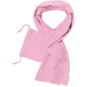 A pink scarf displayed neatly, featuring fringe edges and drawstring ends. It has a tag indicating brand or logo.