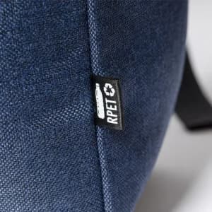 A drink bottle in navy blue fabric with a tag indicating it is made from RPET material.