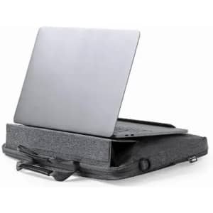 A laptop stand in grey fabric, with a silver laptop positioned on top. The stand features a flat surface and a handle.
