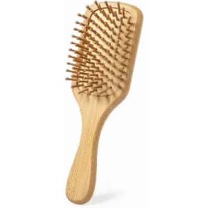 A wooden hairbrush with a rectangular base and rounded teeth, featuring a smooth handle and natural finish.