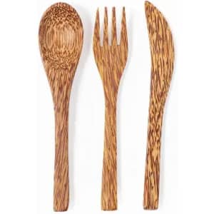 A collection of wooden cutlery including a spoon, fork, and knife, featuring a light brown, textured finish.