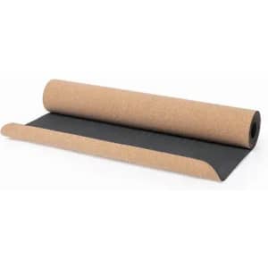 A yoga mat featuring a cork surface with a black underside, rolled partially open. It includes a logo.