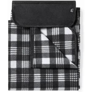 A foldable black and white checked blanket with a black flap, featuring a logo on the corner.