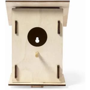 A wooden birdhouse in a natural finish, featuring a circular entrance and a flat roof. The design includes a keyhole mechanism.