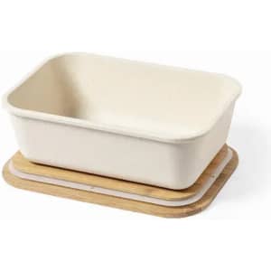 A rectangular cream-coloured bowl sits on a wooden tray. The bowl has a smooth finish and rounded edges.