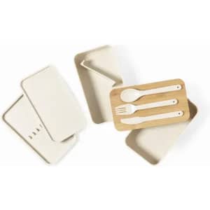 A set of creamy white trays and a wooden tray with white utensils. One tray features a slanted design.