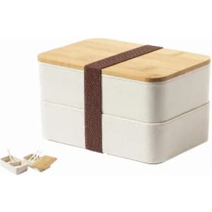 A lunch box with a bamboo lid and two compartments, featuring a brown strap and small utensils on the side.