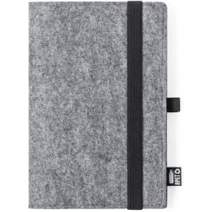 A notebook with a grey felt cover, featuring a black elastic band and a small branded tag on the side.