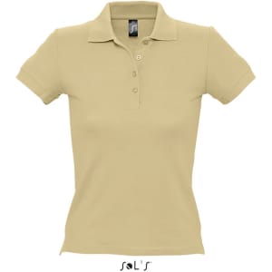 A women's polo shirt in a soft beige colour, made from 100% combed ring spun cotton. It features a collar and buttons and has a logo.