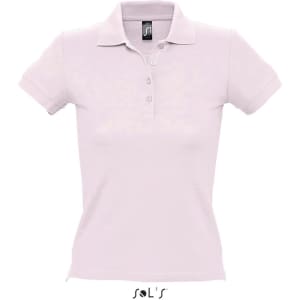 A women's polo shirt in light pink, made from 100% combed ring spun cotton, featuring a collar and buttons.