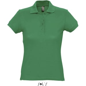 A green women's polo shirt made from 100% ring spun cotton, featuring a collar and buttons, with a brand logo.