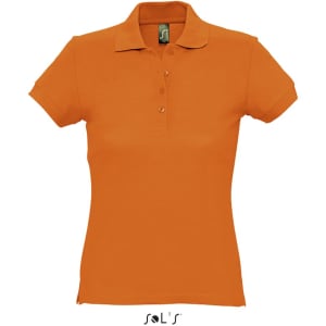 An orange women's polo shirt made of 100% ring spun cotton with a collar and buttons, featuring a logo.