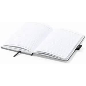 An open notebook with lined pages and a black ribbon bookmark. The cover is a light grey colour.