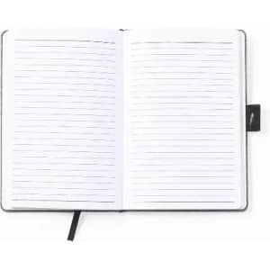 A notebook with a grey cover, featuring lined pages and a black ribbon marker. It has a logo on the cover.