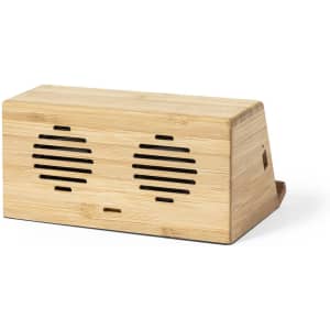 A speaker made of bamboo with two front speaker grills and a sleek, rectangular design.