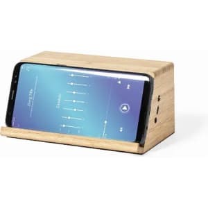 A wooden phone holder with a sleek design, displaying a smartphone angled upwards for easy viewing.