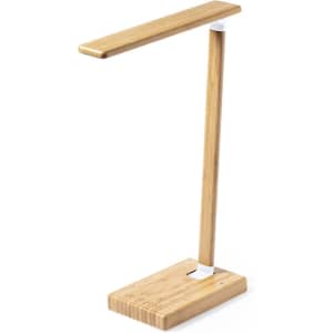 A desk lamp with a bamboo finish and a minimalist design, featuring a rectangular light bar and a square base.