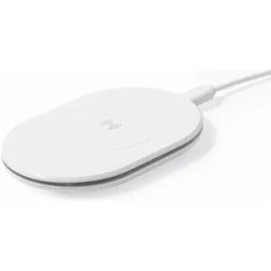 A wireless charging pad in white with a slim, oval shape and a white cable connected.