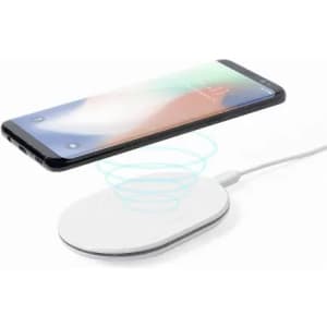 A wireless charger with a round white base and a smartphone hovering above it, indicating charging functionality.