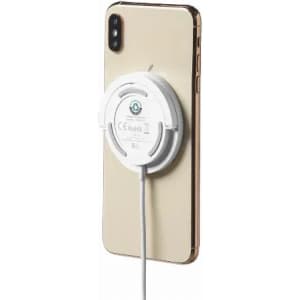 A mobile phone with a white wireless charger attached, featuring a round design and a simple, clean appearance.