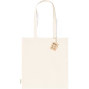 A canvas tote bag in natural cream colour with two handles and a tag attached.