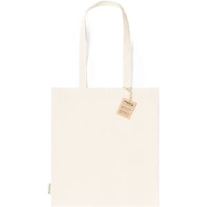 A reusable tote bag in a natural canvas colour with two handles and a tag attached.