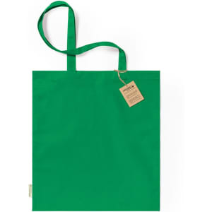 A green tote bag with long handles and a tag attached, featuring a simplistic design.