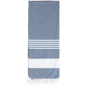 A blue and white patterned towel featuring stripes and fringe detailing at one end.