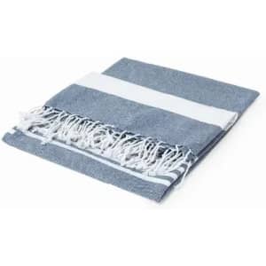 A folded blue and white towel with fringed edges, featuring a striped design. It has a soft, textured surface.