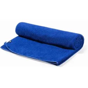 A rolled-up blue towel with a smooth texture, featuring a small logo on one edge.