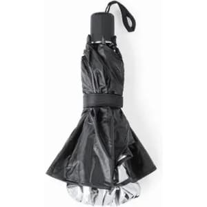 A black umbrella with a silver interior, secured with a strap. It has a compact, folded design.