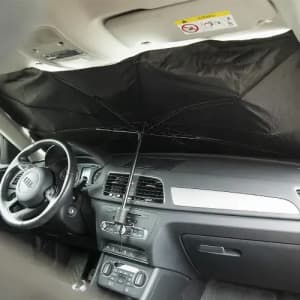 An umbrella designed for use inside a vehicle, featuring a black canopy and a central support pole.
