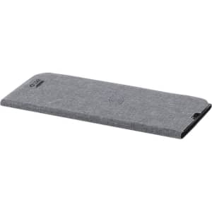A grey wireless charging pad with a textured fabric surface, featuring a logo on one side.