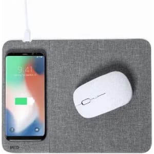 A mouse pad with a grey fabric surface, featuring a wireless charging area for a smartphone and a white mouse.