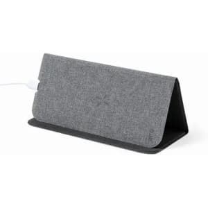 A grey charging dock with a fabric texture, featuring a cable connected to it.