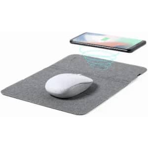 A mouse and charging pad in grey fabric, with a smartphone positioned above, indicating wireless charging.
