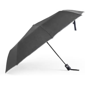 A black umbrella with a silver trim and a curved handle, featuring a logo on its surface.