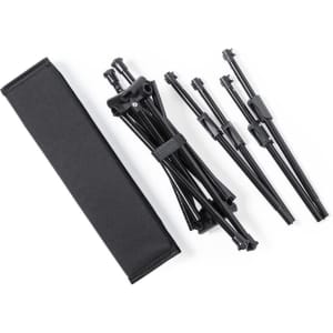 A collapsible black camping tent pole set laid out beside a black carrying pouch.