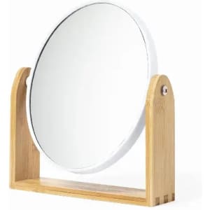 A round tabletop mirror with a wooden stand, featuring a natural bamboo finish and a sleek white border.