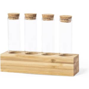A drink bottle holder made of bamboo with four clear glass test tubes topped with corks.