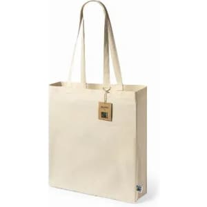 A beige tote bag with two long handles and a tag attached. The bag features a branding logo.
