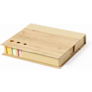 A beige sticky notes and flags holder with a bamboo top and colourful sticky note sections in pastel shades.