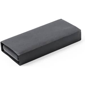 A black rectangular package wrapped in plain dark paper, featuring a smooth surface.
